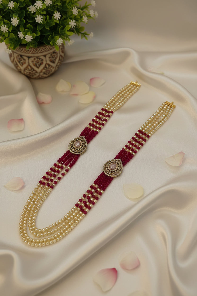 Beaded belt with gold and red threading on a light background